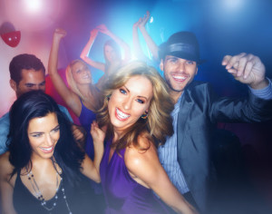 Group of multiracial young boys and girls enjoying in a nightclub